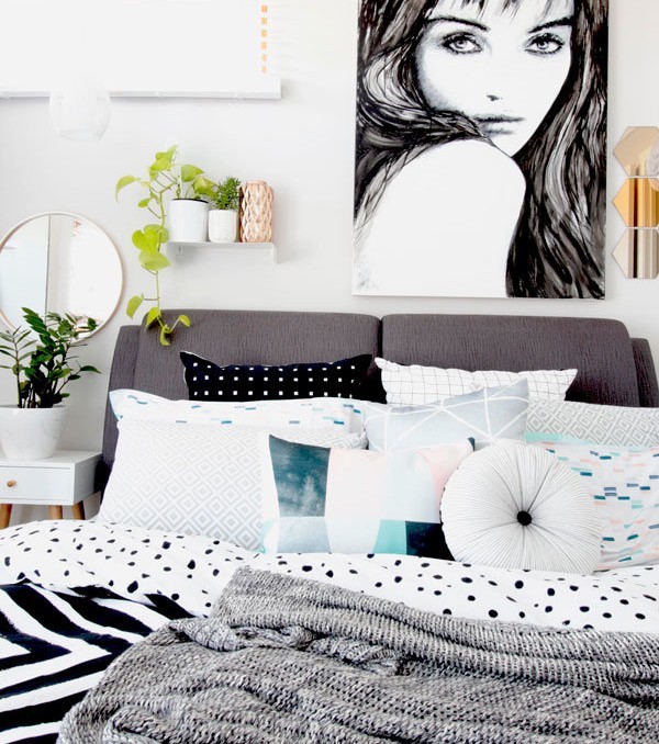 "Take All I Can Get" black and white monochrome female portrait painting by Australian artist Kate Fisher. Styled in modern scandi master bedroom with adairs, Kmart and Ikea accessories.