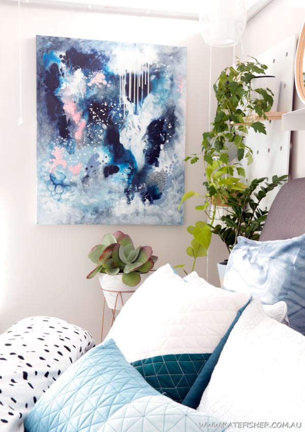 "Dance in the Rain" original abstract artwork in moody blues and grey by Australian artist Kate Fisher styled in modern master bedroom interior with adairs bedding.