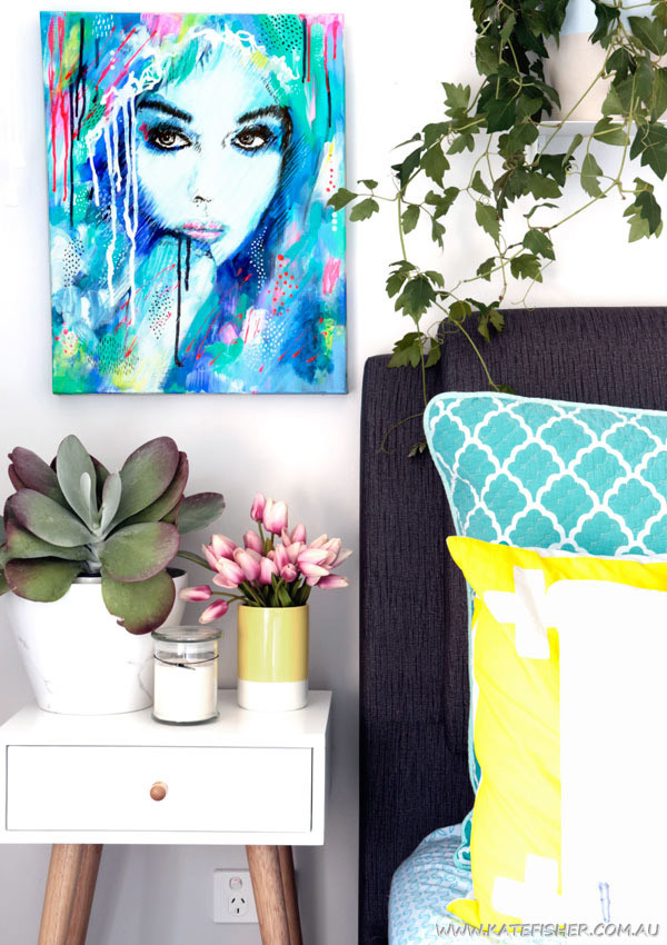 "It's a Man's World" colourful abstract female portrait original acrylic on canvas artwork by Australian artist Kate Fisher styled in modern master bedroom with adairs and kmart accessories.