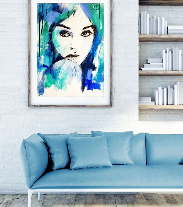 "It's a Man's World" wall art print in blue and green by Australian artist Kate Fisher. Artwork styled in frame in a modern white living room interior.
