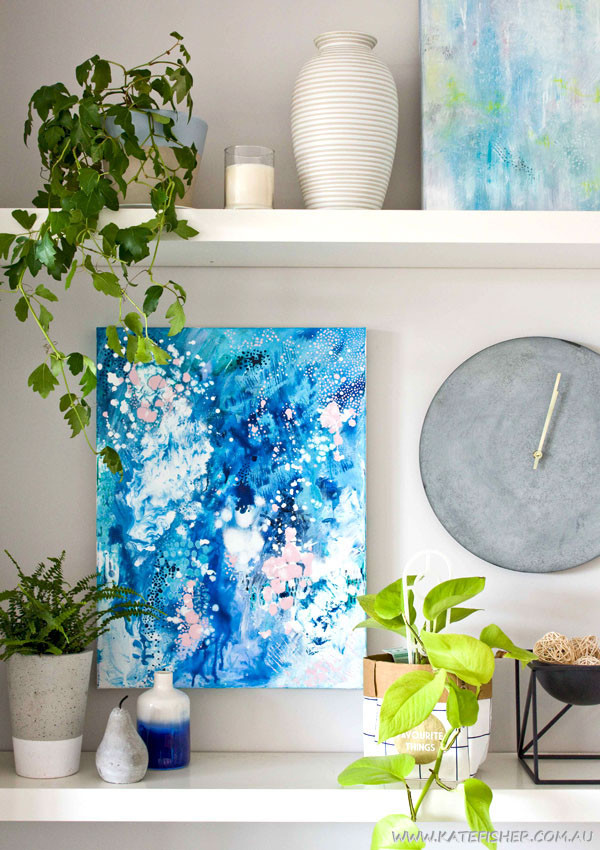 "When Snow Falls" original abstract artwork in blues by Australian artist Kate Fisher. Styled on living rooms shelves with kmart items.