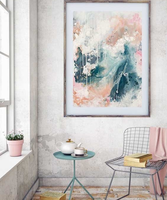 "Nordic Sky" abstract wall art print in soft pastel neutral colours of copper, grey blue and blush by Australian artist Kate Fisher. Styled in modern living room.