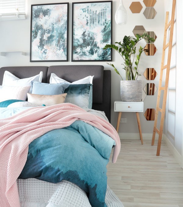 Nordic Sky Storm abstract art prints by Kate Fisher in moody blues, greys and pink. In modern scandi bedroom with adairs bedding.